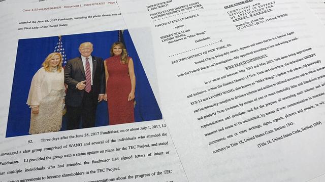 The complaint and affidavit in support of an arrest warrant against Sherry Xue Li and Lianbo "Mike" Wang is photographed on Monday, July 18, 2022. (Department of Justice via AP, File)