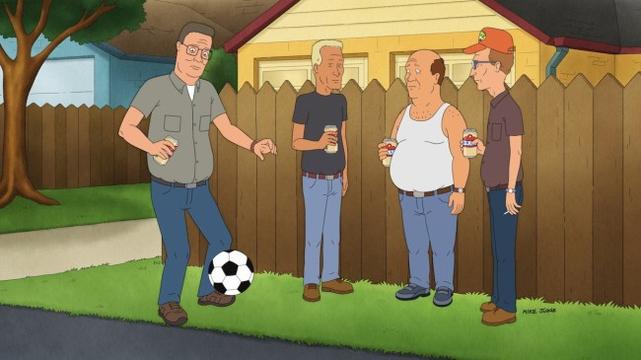 KING OF THE HILL stars Hank Hill, shown standing in the alley with his friends, kicking a soccer ball