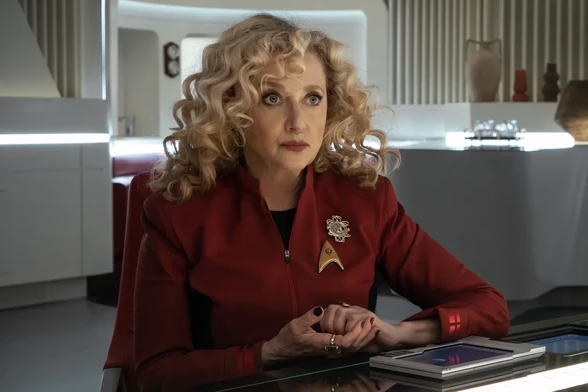 Carol Kane in a publicity photo for Strange New Worlds where she is playing the new chief engineer, and doesn't look like she is 70, let alone as old as the character she played almost 40 years ago.